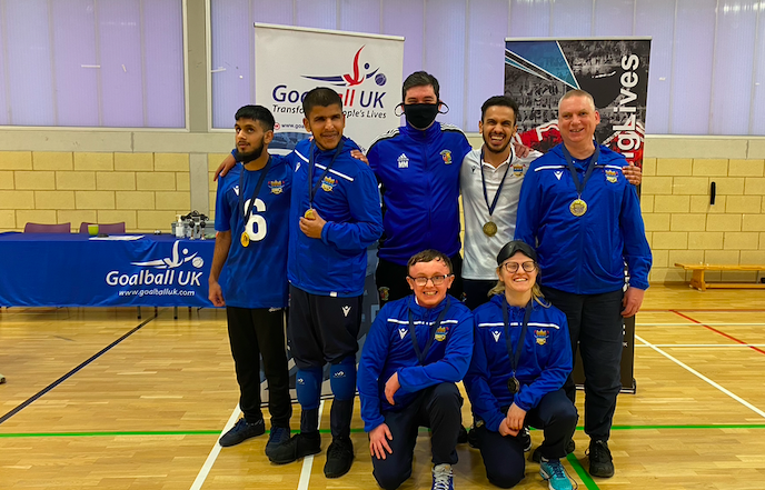 Birmingham Goalball Club Novice team gold medal photo in their snazzy blue tracksuits.