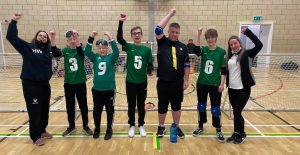 Nottinghamshire Sheriffs novice team all stood on court with hands in the air after winning bronze!