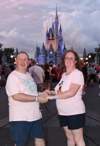 Michael Allan and partner at Disneyland Florida in front of the famous Disney castle.