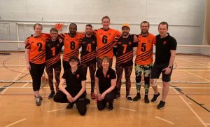 Fen Tigers and Fenland Tigers standing together on court in their tigers jerseys after a super league Matchday.