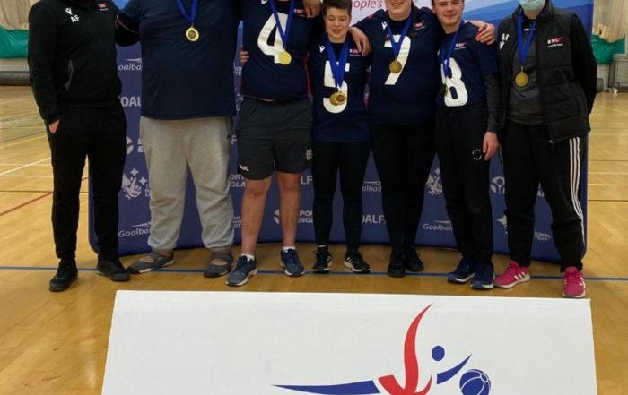 RNC Novice Shield Winners team photo with left to right: Coach Aaron, players Ryan, Conall, Freya, Maddie, Robyn and then Coach Anna stood together with big smiles!!