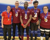 Northern Allstars standing with their gold medals after winning the Goalfix Cup 2022. From left to right: Faye, Matt, Caleb, Naqi, and Emma all in their maroon jerseys.