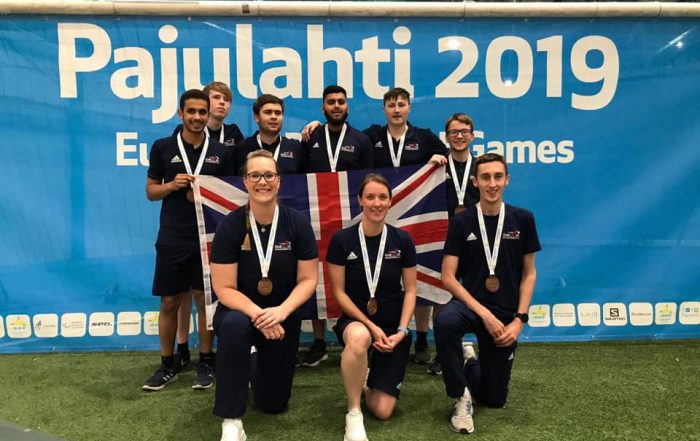 The under 23's squad who won bronze at the European Para Youth Games back in 2019. Left to right, standing: Mo, Stu, Sam, Naqib, Josh, and Joe. Kneeling below them: Krista, Faye, and Alex, all with beaming smiles!
