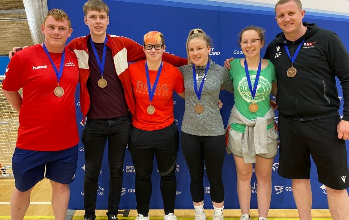 RNC Academy Goalfix Cup 2022 team photo with their bronze medals. Left to right: Assistant coach Chris, Stuart, Meme, Megan, Antonia, and head coach Aaron.