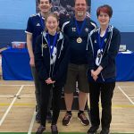 Winchester Kings with their bronze medals, along with coach Tom Exley.