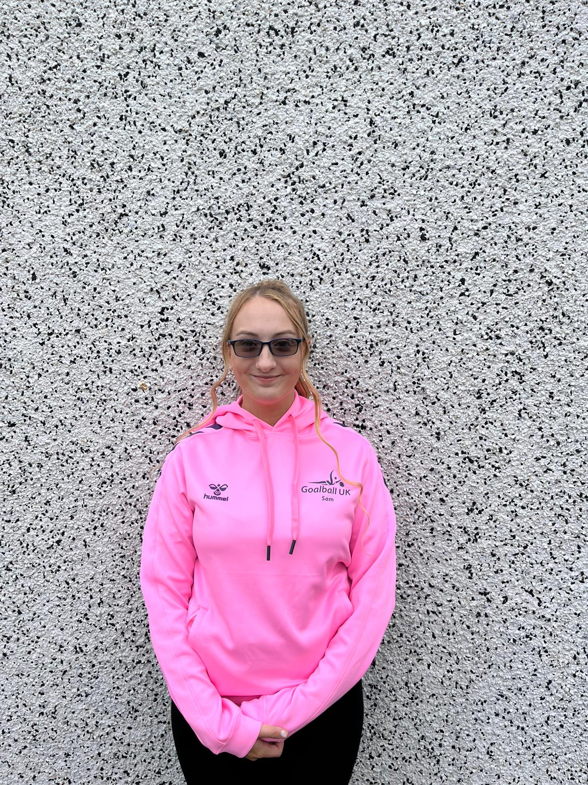 Samantha in her pink Youth Forum hoodie