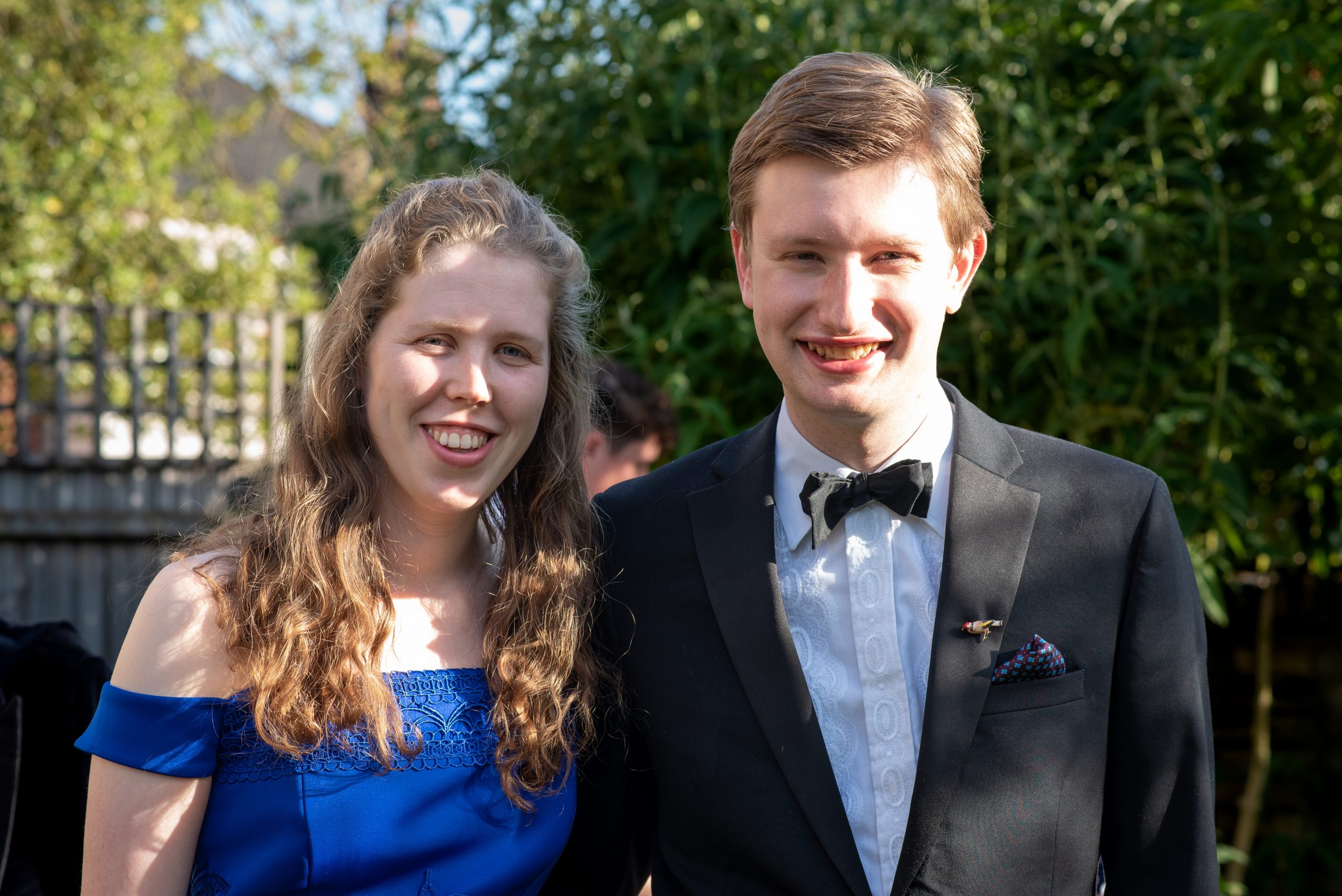 Andrew standing with his girlfriend Gemma dressed up very fancily ahead of a College Summer Party.