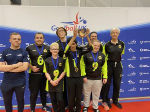 Croysutt Warriors novice team standing together with their National Finals gold medals!