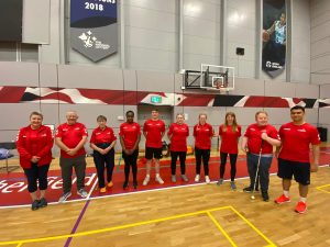 Volunteers and referees in red shirts at the National finals