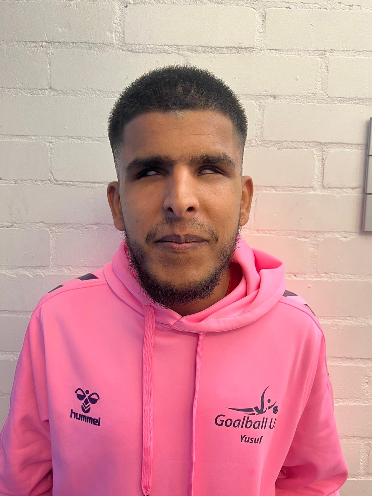 Yusuf in his pink Youth Forum hoodie