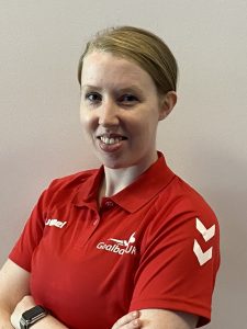 Georgina Bullen profile shot wearing a red goalball top