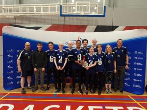 The Winchester contingent at the National Finals 2022, with Novice & Elite players mixed in for a team photo in front of a big blue Goalball UK banner.