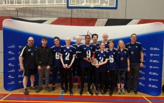 The Winchester contingent at the National Finals 2022, with Novice & Elite players mixed in for a team photo in front of a big blue Goalball UK banner.