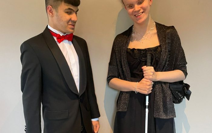 Mustafa Abbas and Martha of New College Worcester standing together in formal attire whilst at the Worshipful Company of Lightmongers Court Dinner.