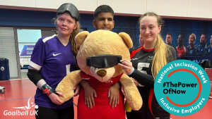 Three youth forum members with Dale the bear wearing an eye shield. They are looking toward the camera. There is a National Inclusivity Week logo in turquoise on the bottom right.