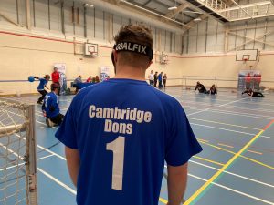 Cambridge Dons player looks out on to the court as his team throws the ball