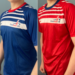 a young adult is wearing a blue shirt on the left and red on the right. The shirts are both made of sports material with a Goalball UK logo on the chest, white stripes up to the neck and the names of supporters are listed continuously across the shirts.
