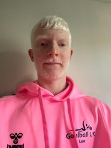 Profile photo of Youth Forum member Leo Stubbs in his pink Youth Forum hoodie