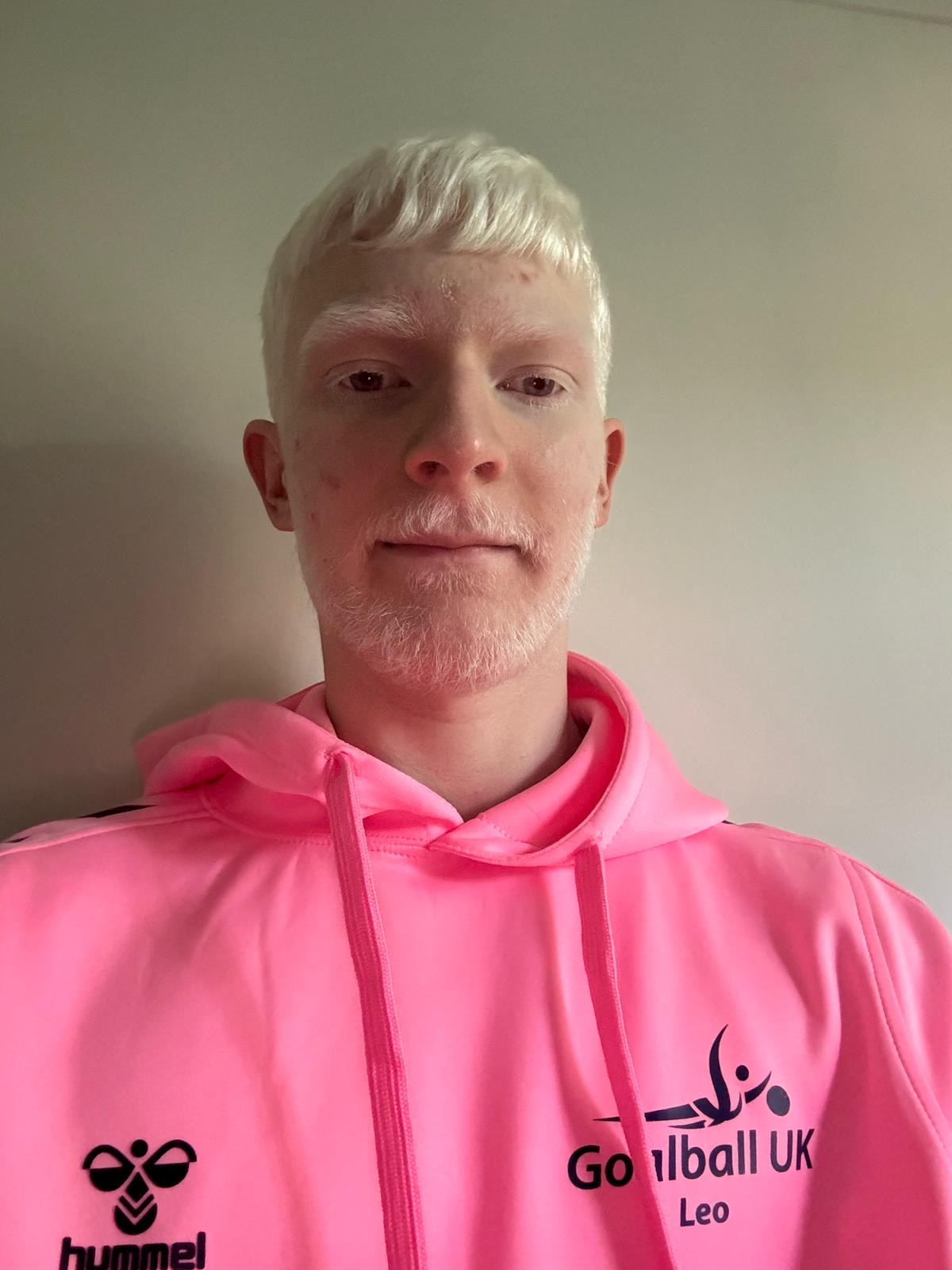 Profile photo of Youth Forum member Leo Stubbs in his pink Youth Forum hoodie