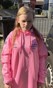 Profile photo of Youth Forum member Alleah Beard-Pace in her pink Youth Forum hoodie