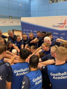 GB hands in! Everyone has their hand in the middle as a big circle of people within the GB Men, Women, and Academy come together to sign off the competition and camp.