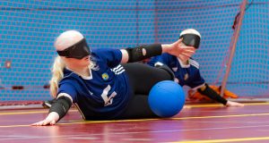 Aure of Winchester Goalball Club diving to save a ball during a game playing in centre position.