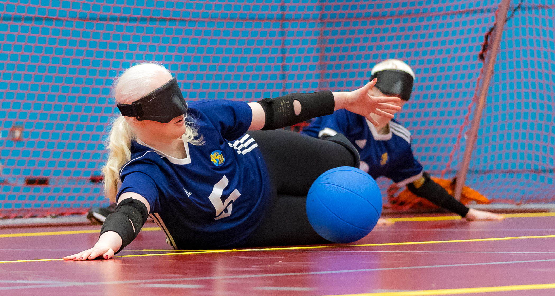 5R0A4920 Aure of Winchester Goalball Club diving to save a ball during a game playing in centre position.