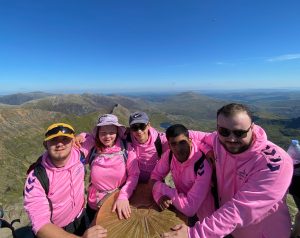 Chelsea and her fellow Youth Forum members at the top of Snowdon as part of the Youth Forum's climb to raise money for Summer Camp.