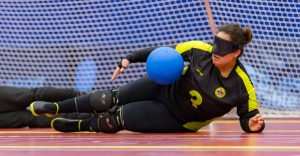 Female player blocking a shot.