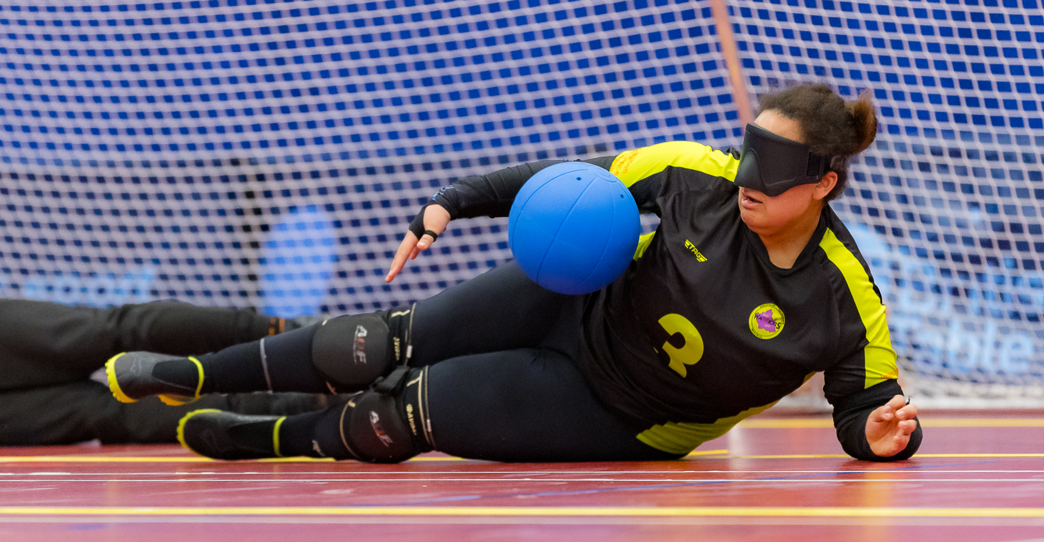 Female player blocking a shot.