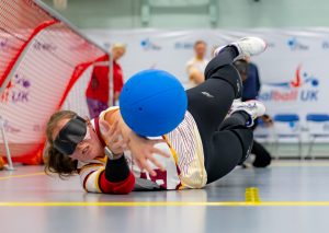 Female player saving a shot.