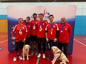 London Elephants group photo, all wearing their red jerseys and receiving a medal.