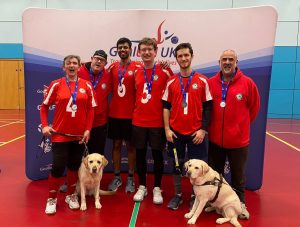 A team celebrating with medals.