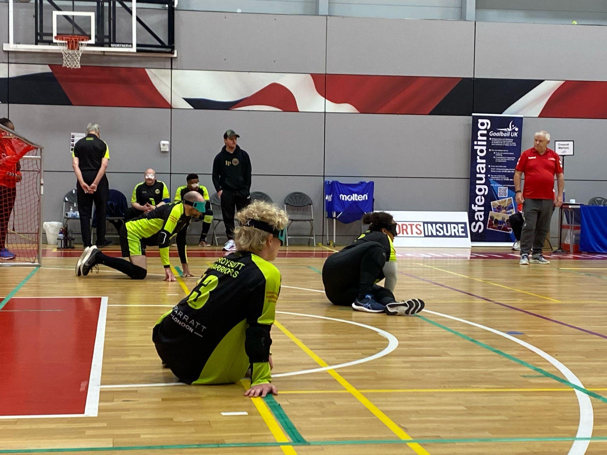 A photo from the last Sports Insure competition of players on one half of the court in the ready position.