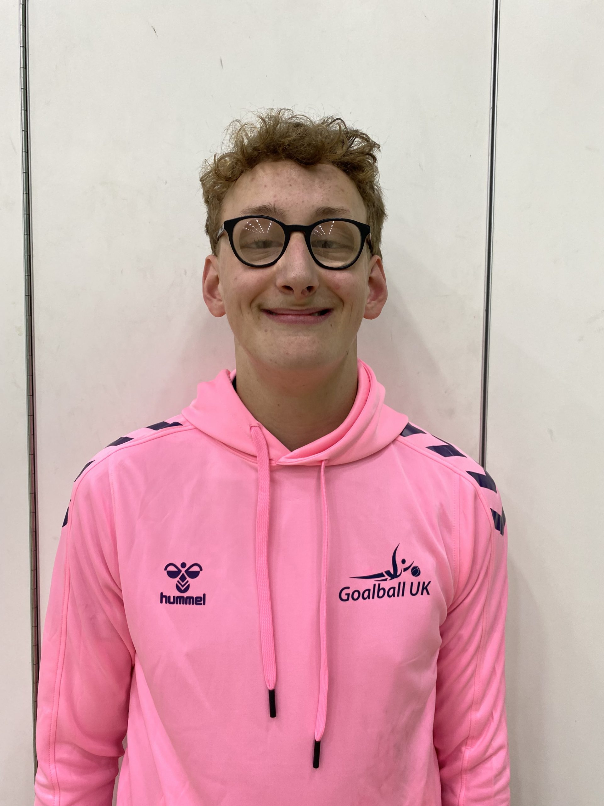 Jacob Evans in his pink Goalball UK Youth Forum hoodie